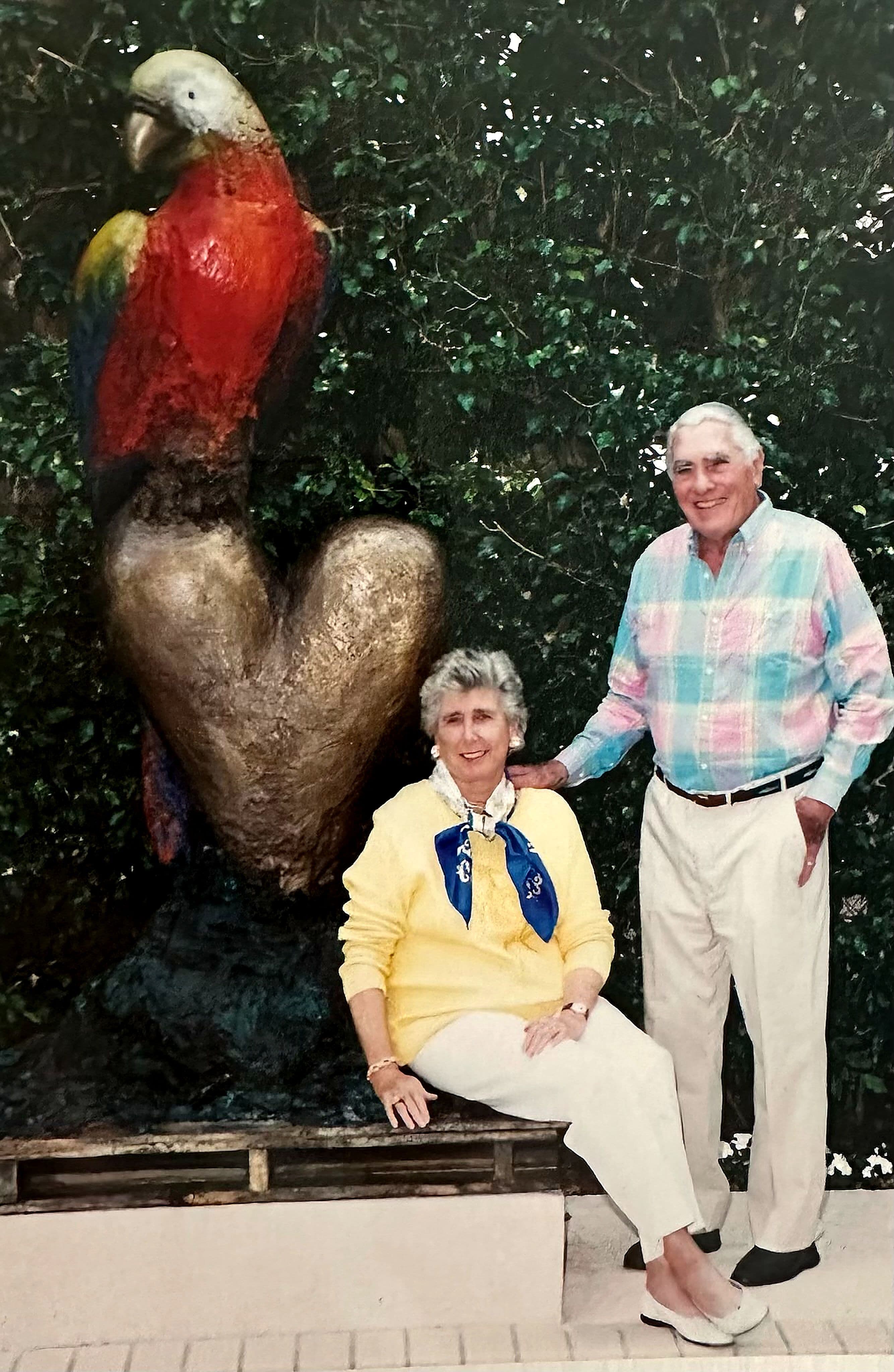 Dee and John Hildt with King Parrot sculpture